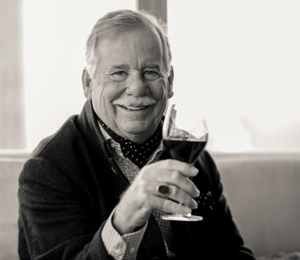 Image of Fred Schrader, founder of Schrader Cellars, with a glass of wine