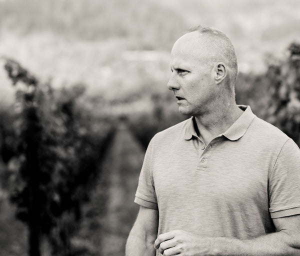 Image of Thomas Rivers Brown, Schrader Cellars winemaker, in a Napa Valley vineyard